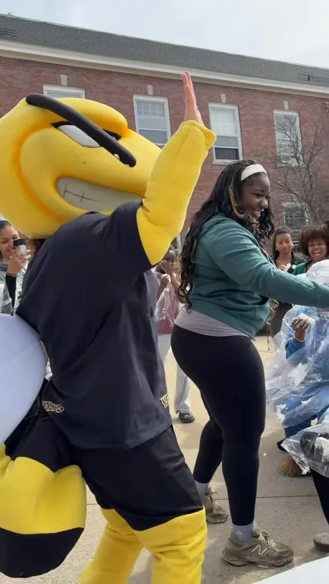 AIC Yellow Jackets mascot at a spring campus event, Instagram Reel for @aiconcampus